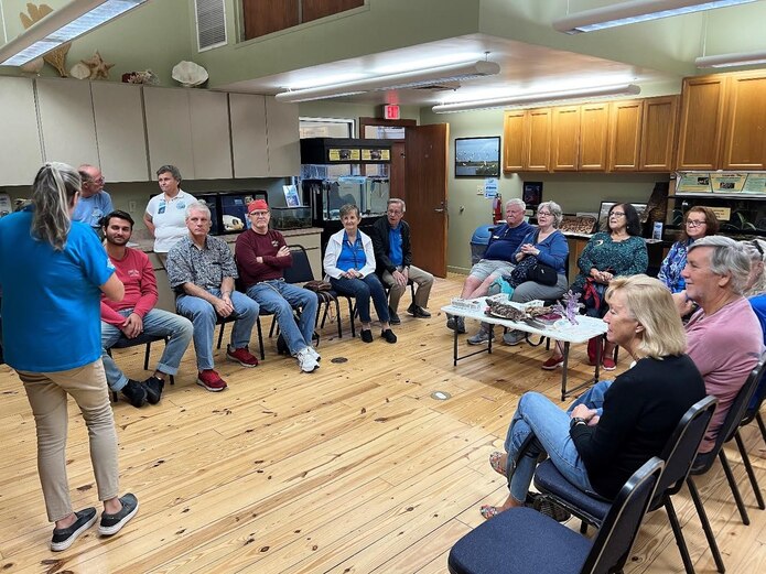 PILH Volunteers and staff learn about raptors at the Marine Science Center during one of the many volunteer outings provided by the Ponce Inlet Lighthouse