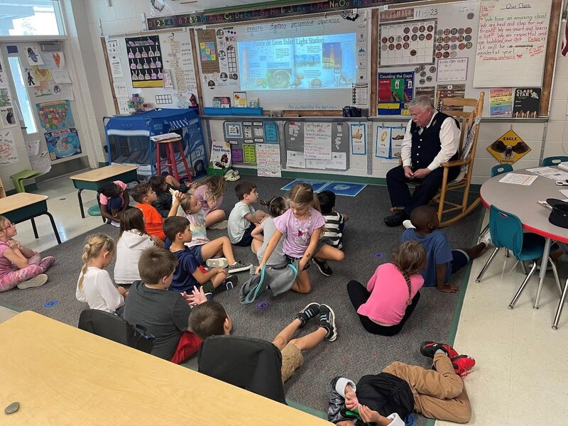PILH Lead Docent John Mann reading to students in the classroom